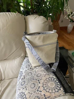 Urban Bags For City Life And Streetwear Fashion Mid size cream colored leather crossbody with contemporary jacquard interior. Urban Bags For City Life And Streetwear Fashion Mid size cream colored leather crossbody with contemporary jacquard interior.