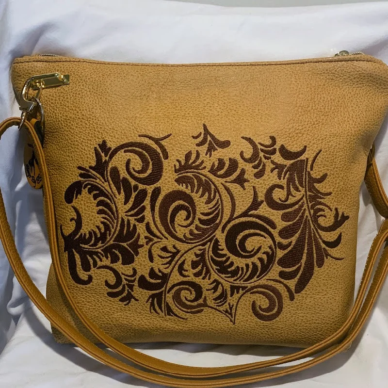 Bags With Tsa-Approved Features Beautiful crossbody of caramel colored Italian leather with embroidery Bags With Tsa-Approved Features Beautiful crossbody of caramel colored Italian leather with embroidery