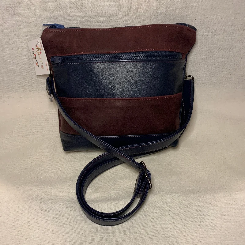 Contemporary Chic Promotions Classically designed all leather crossbody bag with burgundy and navy stripes. Contemporary Chic Promotions Classically designed all leather crossbody bag with burgundy and navy stripes.